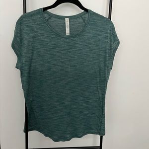 Lululemon Tee. Heathered teal color. Size 10. Fits like a M/L.